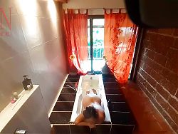 Peep. Voyeur. Housewife washes in the shower with soap, shaves her pussy in the bath. 22